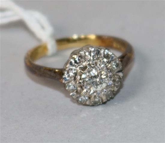 An 18ct gold and diamond cluster ring, size J.